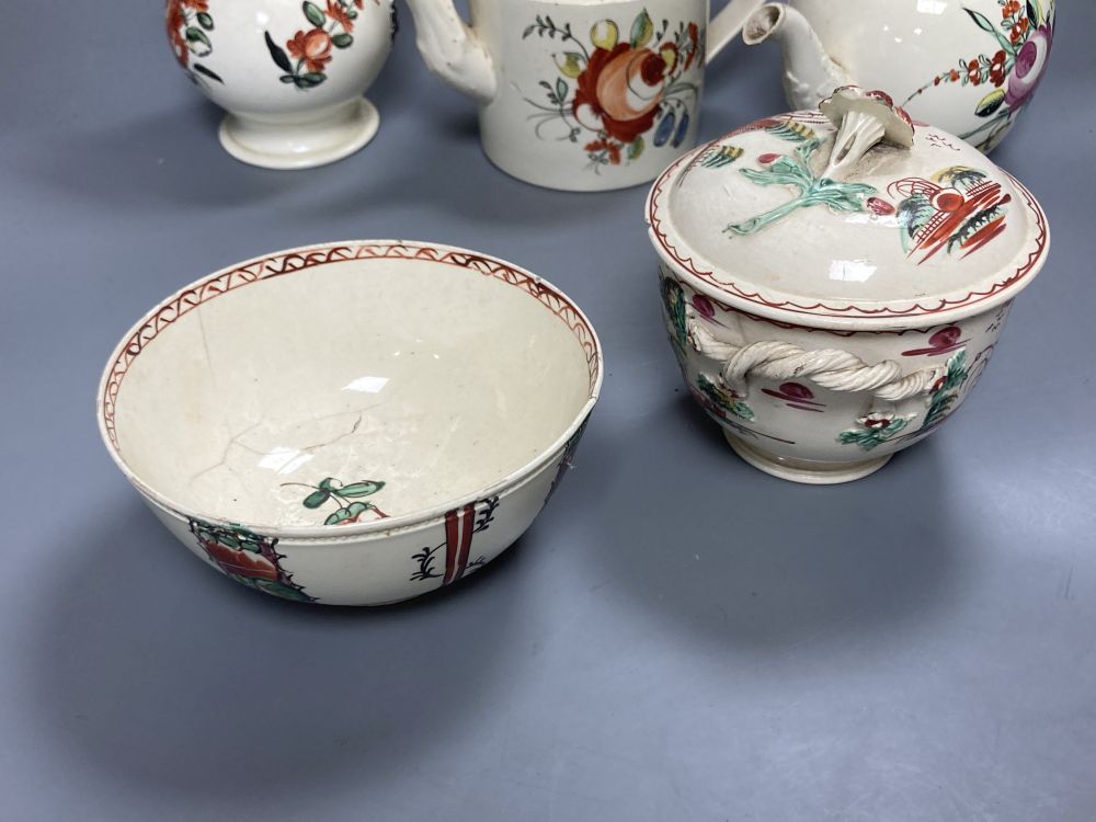 A collection of nine pieces of late 18th century creamware, including bullet-shaped teapot, 11cm high and four tea canisters with silve